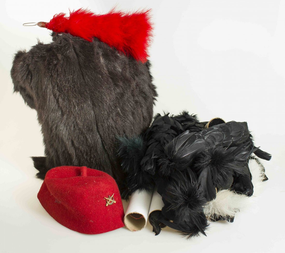 Lot of Hats, Some European, Some American and Mostly: 1. French Military Fez for Algerian native troops with brass crescent moon with word “IFNI” in black enamel over crossed rifles with 5 pointed star. 2. Older “bearskin” headdress, possibly of 