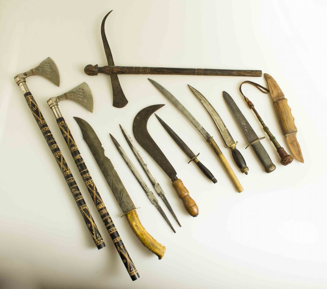 Lot of 12 Ethnographic and Primitive Weapons With 2: 1. A small African axe with carved head. Probably 19th century. 2. Tourist quality Indian Axe, circa 1930’s. 3. Same as #2. 4. African sickle-shaped knife, razor sharp. 5. Burmese Dha Knife, possibl