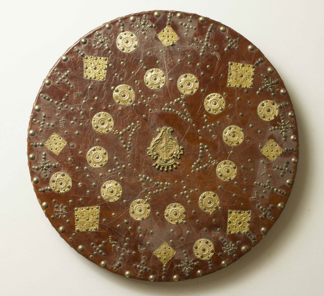 Scottish Targe or “Target” Reproduction Shield: Covered in red leather with brass tack decoration. This is a functional reproduction complete with rear straps. Please note we do not accept credit cards. Processing and shipping within the continenta