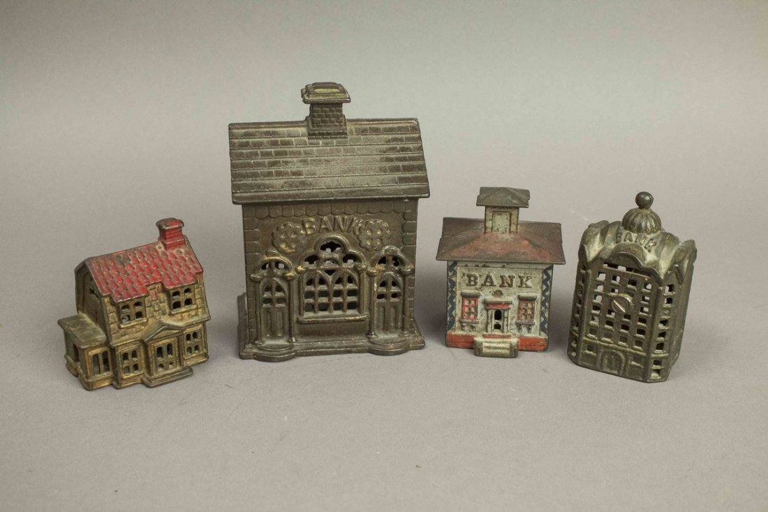 4 Cast Iron Still Banks: 4 Cast Iron Still Banks. Three have the word "Bank" cast in them. One is a two-story house. Processing and shipping within the continental U.S. $25.00 plus 1.5% replacement cost insurance. W