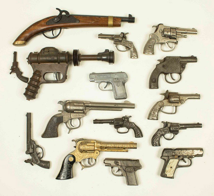 15 Assorted Cap Guns: 15 Assorted Cap Guns, in both cast iron and pot metal. Cap guns include Hubley Police 38 "Dandy", Kilgore "Big Bill", Wyandotte "Hopalong Cassidy Gun" (in Gold) and Daisy "Buc