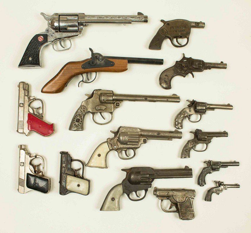 15 Assorted Cap Guns: 15 Assorted Cap Guns, in cast iron, steel, wood and pot metal. Cap guns include Kenton "Gene Autry", Kilgore "Safety Trooper" and Nichols "Stallion 45". Processing and shipping within the contine