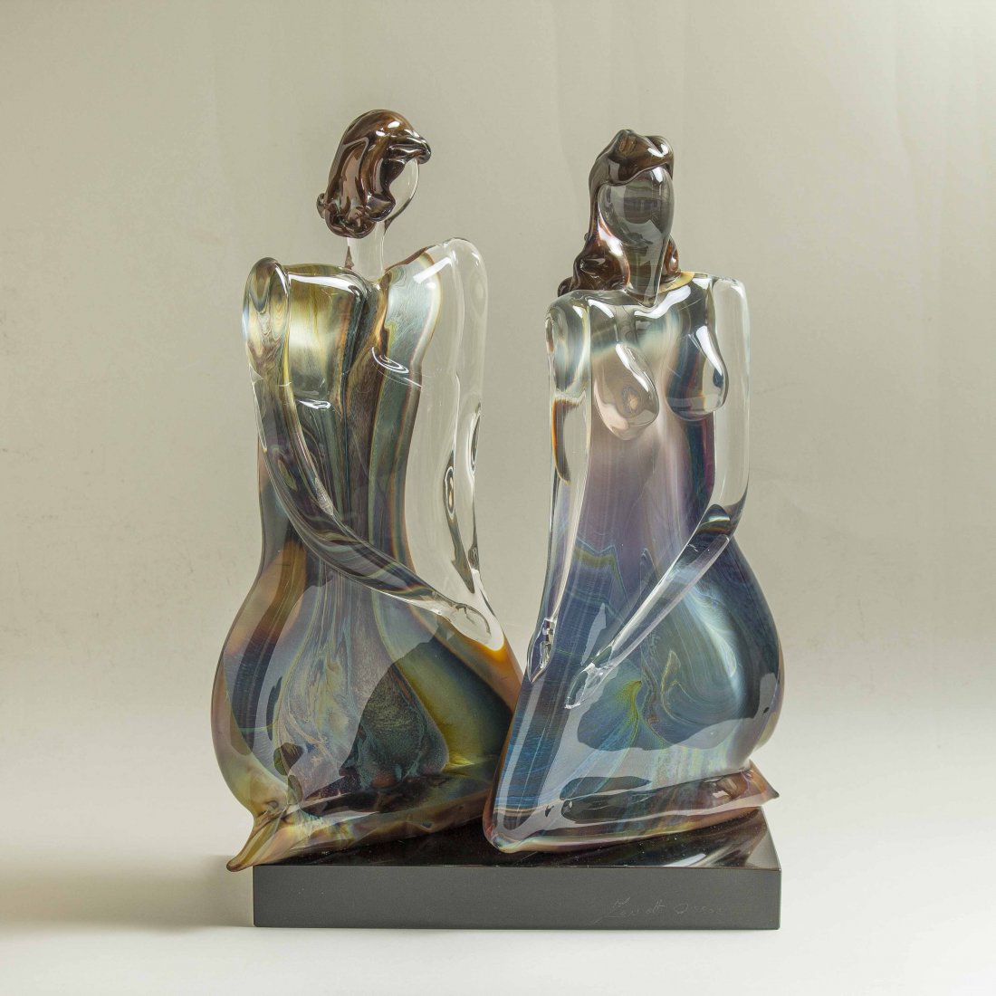 Oscar Zanetti (b. 1961) Murano Glass Sculpture: Oscar Zanetti (b. 1961) Murano Glass Sculpture. Depicting a male and female on a black plinth. Signed Oscar Zanetti. Dimensions: 14 x 6 1/2 x 20h. Provenance: Accompanied by original receipt from 