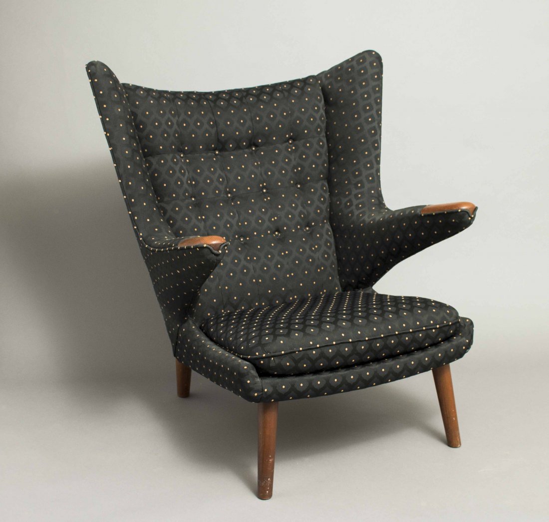 Hans Wegner Papa Bear Chair: Hans Wegner (1914-2007) Papa Bear chair with tufted black upholstery and wood hand rests raised on four cylindrical wood legs. Bears Danish control label and stamped "10" on underside. 38.5"h x 35.5"w