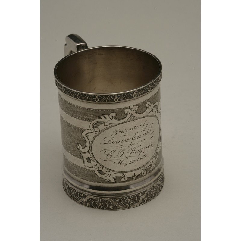 Koehler & Ritter (1868-1885) Silver Presentation Cup: Silver presentation cup with floral rolled rim bands and extensive chased and engraved decoration by Koehler & Ritter, active 1868-1885, San Francisco. Engraved, "Presented by Louise Ervald to C.F. 