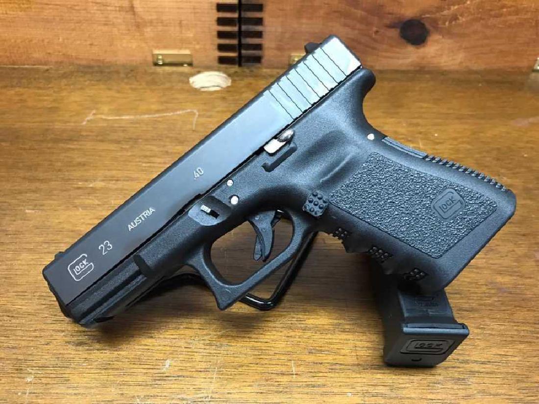Glock 23 .40 S&W Customized with Night Sights,: The GLOCK 23 is ideal for a more versatile role because of its reduced dimensions when compared to the standard sized option. Chambered in.40 S&W, the G23 has found worldwide acclaim with both private