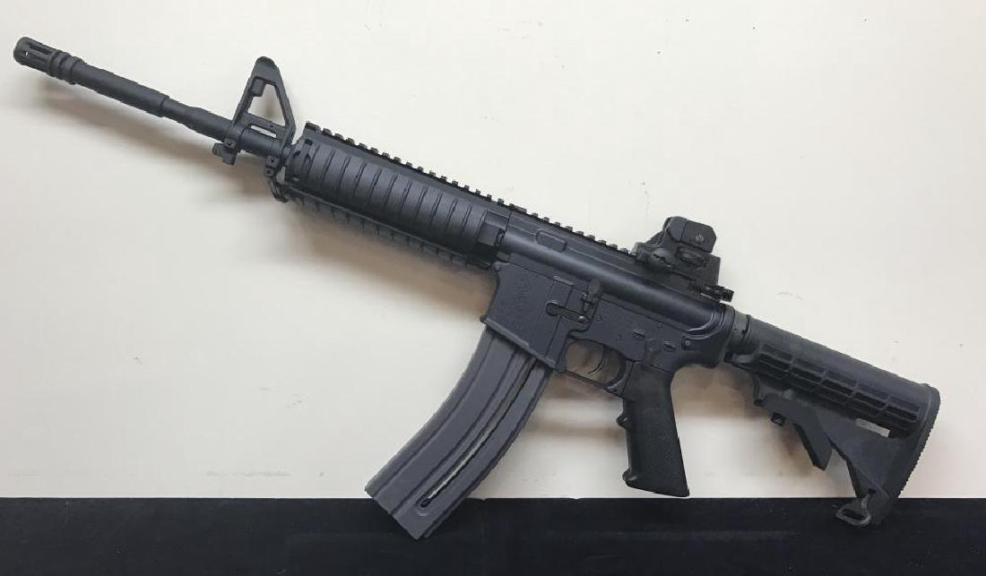 USA Colt M4 OPS Semi Auto Rifle .22 Caliber: The Colt M4 OPS Rifle is a true replica of the M-16 used today. It has a 16 inch, Ops barrel and collapsible stock. The quad skeleton forend has accessory rails. It features an adjustable rear sight a