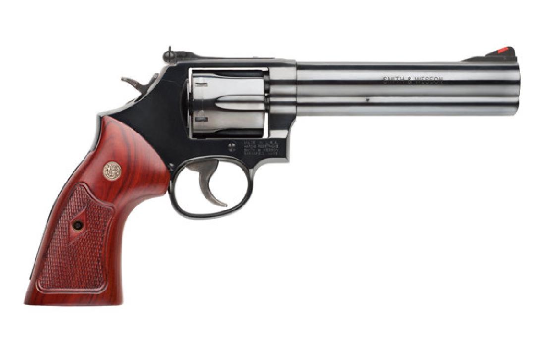 Smith & Wesson Revolver: Double Action 586 Series 357: Manufacturer: Smith & Wesson Gun Type: Revolver: Double Action Model Series: 586 Caliber: 357 Action: Double Action Magazine capacity: 6 Finish: Blue Stock: Wood Grip Sights: Front: Red Ramp Rear: Adj