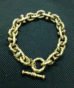 Ladies Heavy Ruby and Sapphire 18K Gold Bracelet: Ladies Heavy Ruby and Sapphire 18K Gold Bracelet. Bracelet made with twisted anchor style chain. Signed 750.