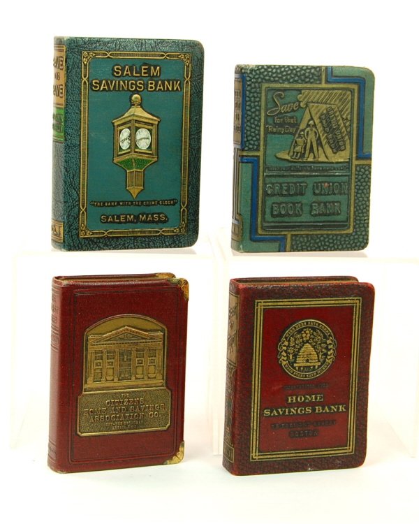 Lot of 4 book banks: Leatherette over Brass. "Home Savings Bank", "Credit Union Book Bank", "Citizens Home and Savings", "Salem Savings". Largest is 5 1/8 in. tall.