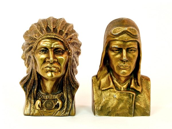 Lot of 2 bust banks: Lead: Indian Chief bust (Largest Hand Dug Well Greensburg, Kansas) 6 1/4 in. tall. Aluminum: "Lindy" bust 6 1/4 in. tall.