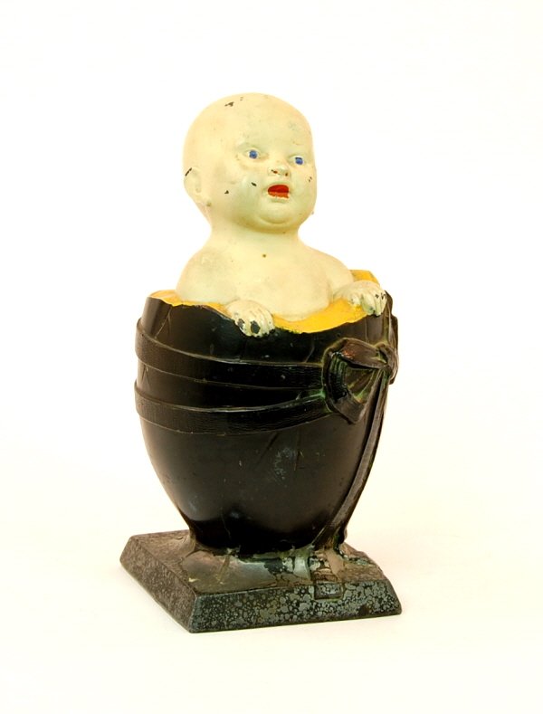 Baby in Egg bank: Lead. 7 1/4 in. tall.