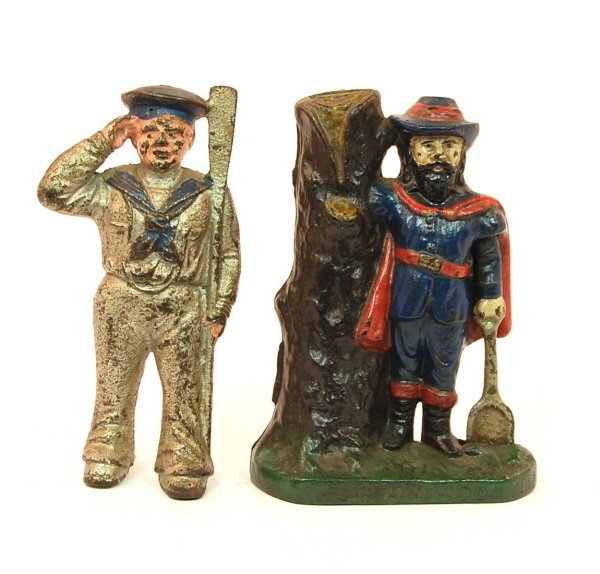 Lot of 2 figural banks: Cast Iron. "Captain Kidd 5 5/8 in. tall. Large Sailor 5 3/4 in. tall.