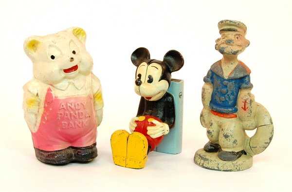 Lot of 3 character banks: Composition: "Andy Panda" bank 6 in. tall. Cast Iron: Mickey Mouse bank 5 in. tall. White Metal: Popeye bank 6 3/8 in. tall.