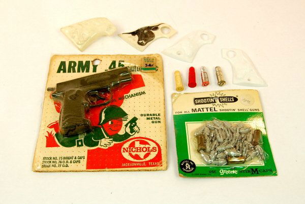 Lot of cap gun related material: "Army 45" cap gun on hang card; Box of Mattel shooting shells; loose bullets and grips.