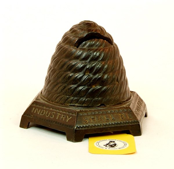 Beehive bank: Cast Iron. 4 1/8 in. tall. Ex. Moore collection.