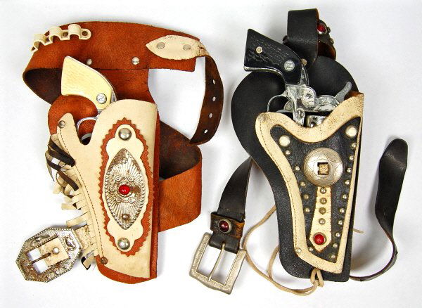 Lot of 2 Cap Guns & Holsters: Cream & Brown holster contains a "Stallion 22" gun. Black & White holster contains a Nichol "Stallion" gun.
