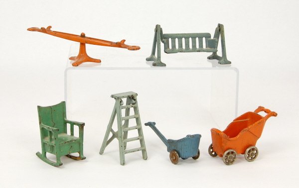 6 Cast Iron dollhouse accessories: Ladder, Teeter-totter, Porch Glider, Rocking Chair, Pram, & Stroller.