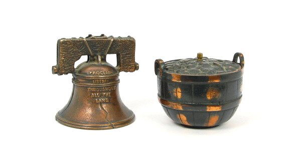 Fruit Basket & Liberty Bell banks: Cast Iron. 2 3/4 in. & 3 1/2 in. respectively.
