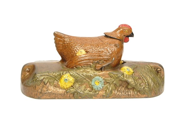 Hen & Chick mechanical bank.: Cast Iron. 4 1/2 in.