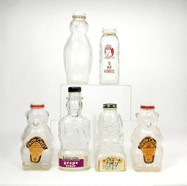 Lot of 6 Glass banks with metal caps.: Uncle Sam, Elephant, Bear (2), Penguin & Baby Bottle "To Her Highness".