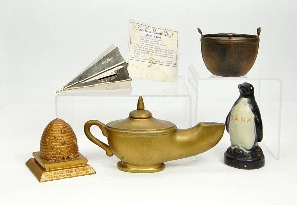 Lot of 5 misc. banks.: Penguin; Registering Basket; Beehive on Base; Umbrella; & Alladin's Lamp.