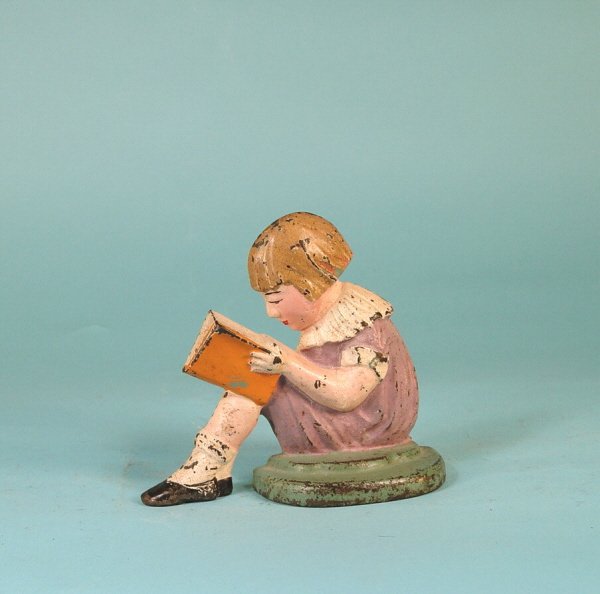 CI Doorstop in the form of a Girl reading a book (1 of 2)