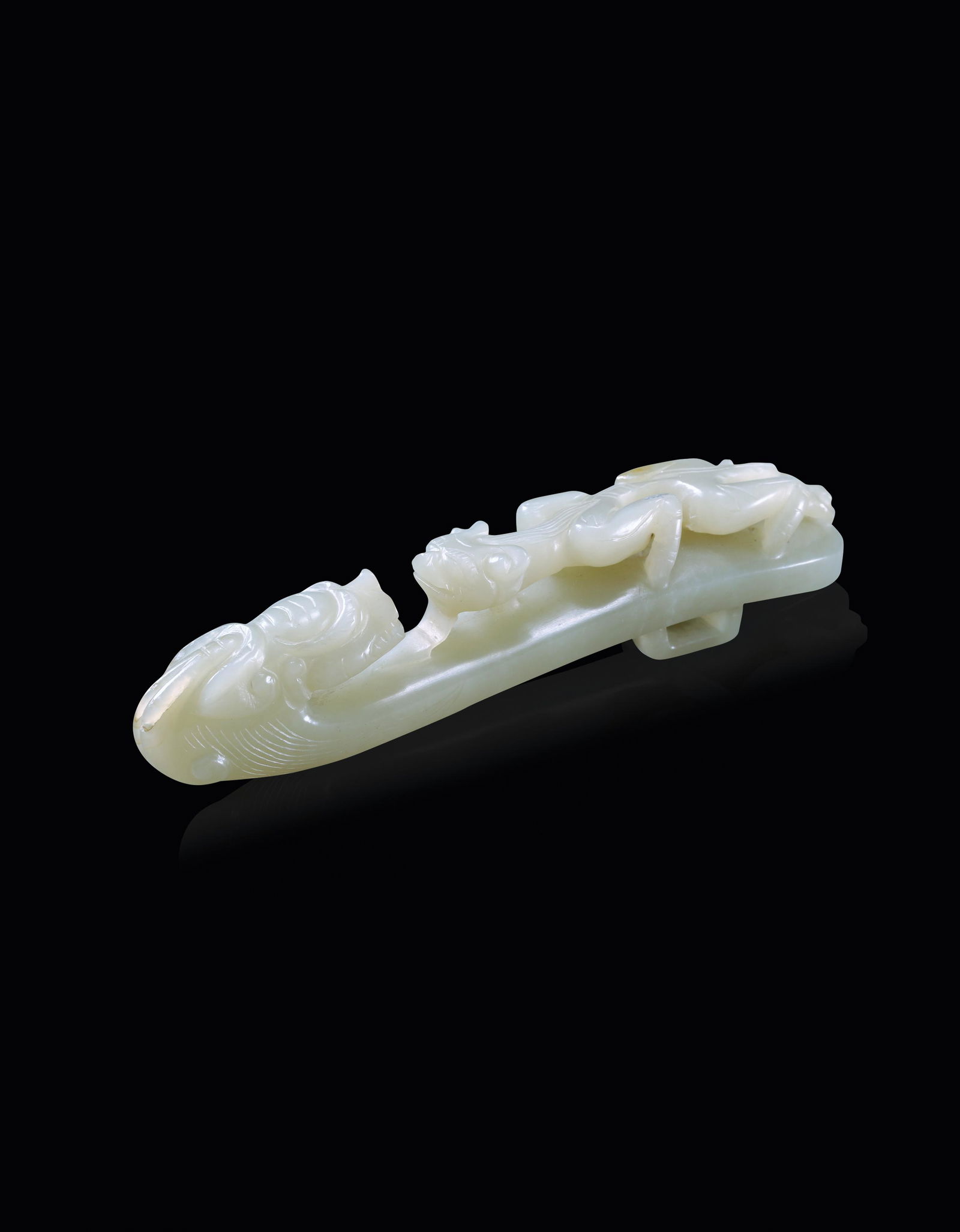 A Chinese White Jade Dragon Hook Qing (1 of 5)
