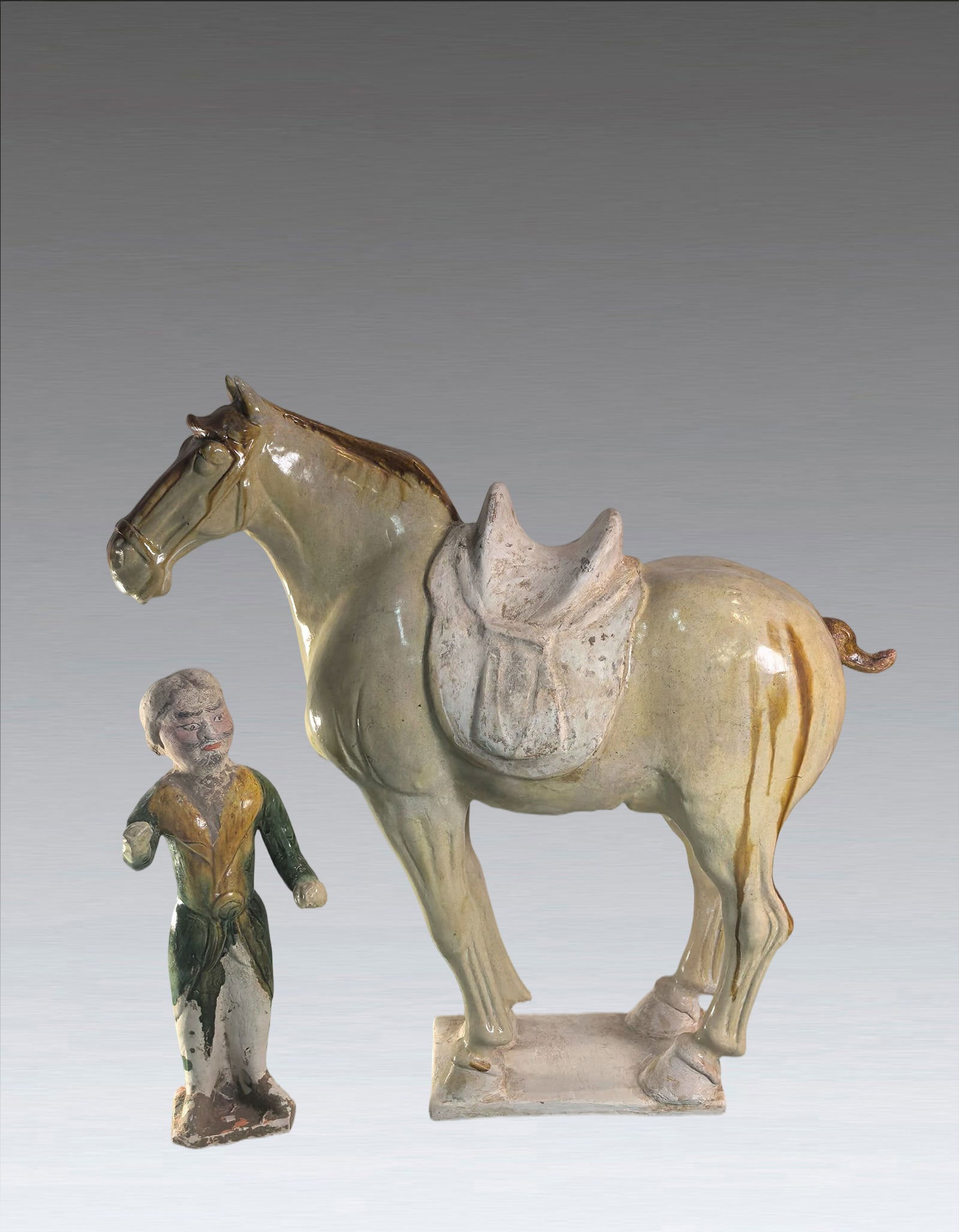 A Chinese Sancai Glazed Pottry Horse and Figure Tang Dynasty 618-907 (1 of 9)