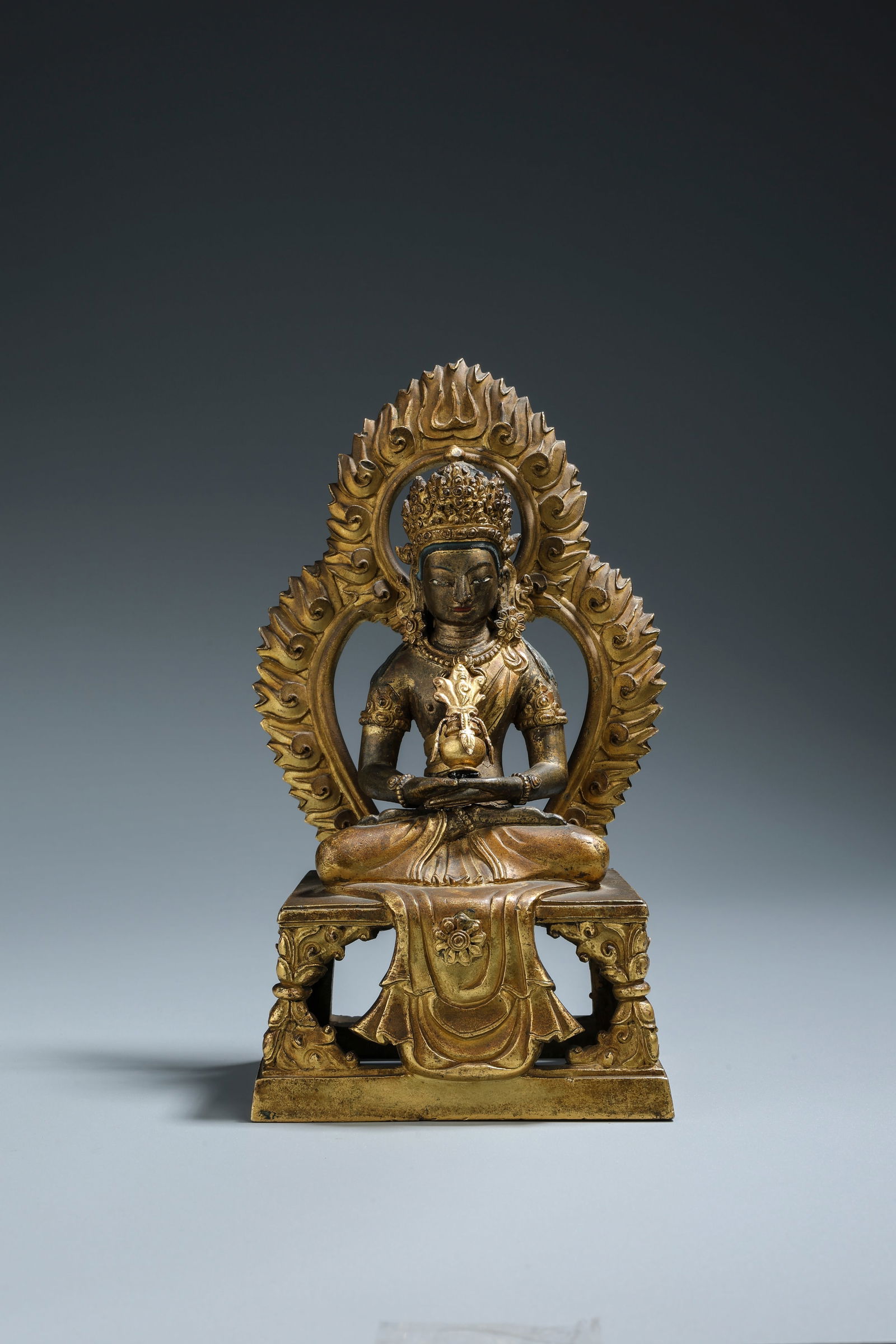 A Gilt Bronze Figure of Amitayus Qing Dynasty 1644-1912: 251204 清铜鎏金无量寿佛坐像 1644-1912 A Gilt Bronze Figure of Amitayus Qing Dynasty 1644-1912 USD5000-8000 H20.7CM(带背光&
