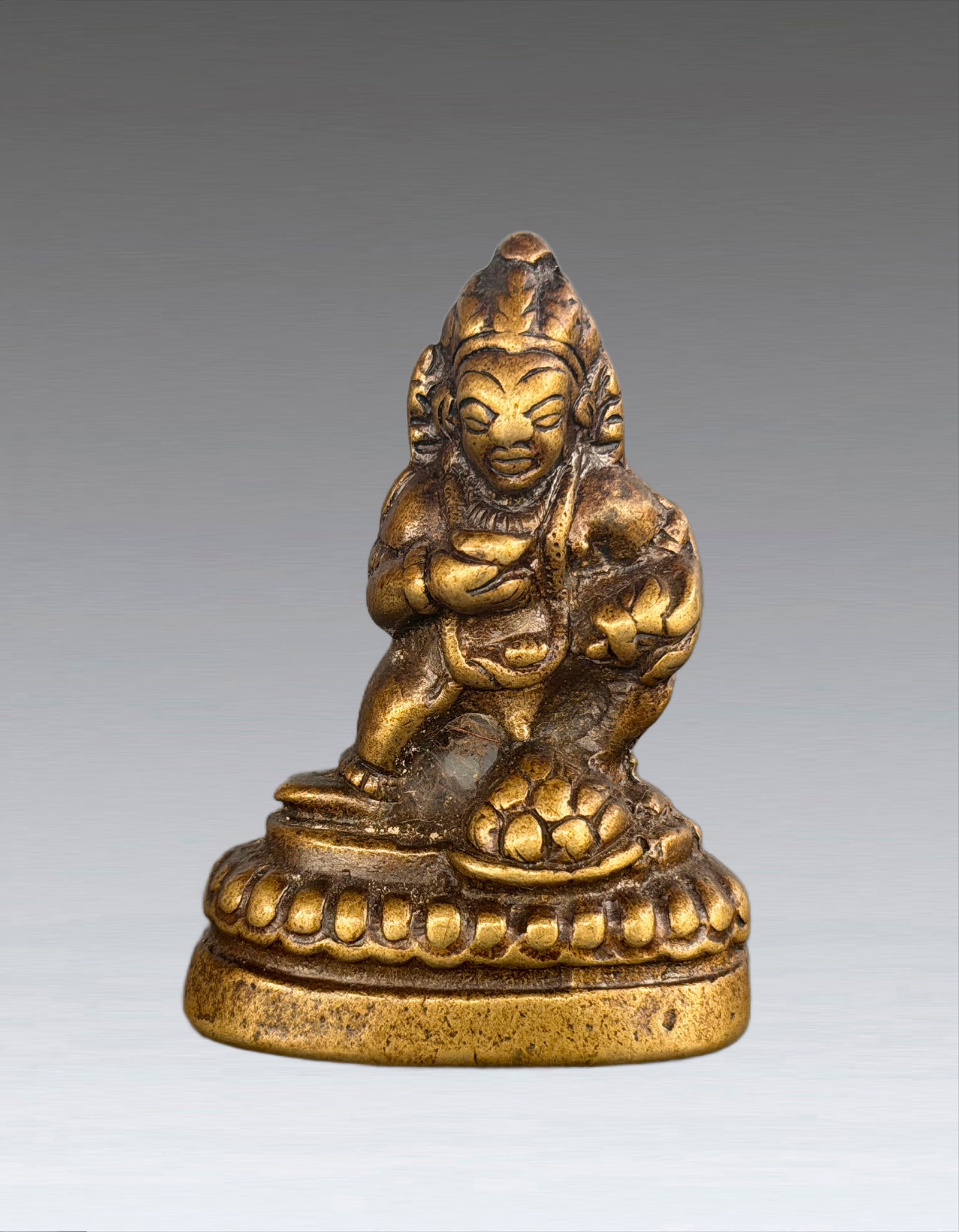 A Tibetan Gilt Bronze Figure of Jambhala 17 Century (1 of 9)