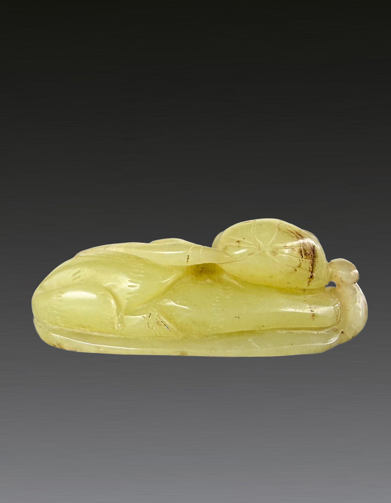 A Chinese White Jade Cat Qing Dynasty 1644-1912: 261196 清和田玉卧猫 1644-1912 A Chinese White Jade Cat Qing Dynasty 1644-1912 USD800-1000 L6.2cm，54.6g 清和田玉卧猫ᦁ