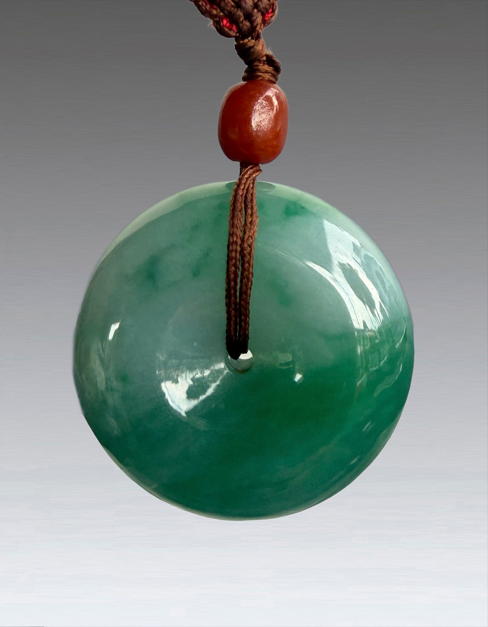 A Natural Jadeite Disc Pendant (1 of 8)