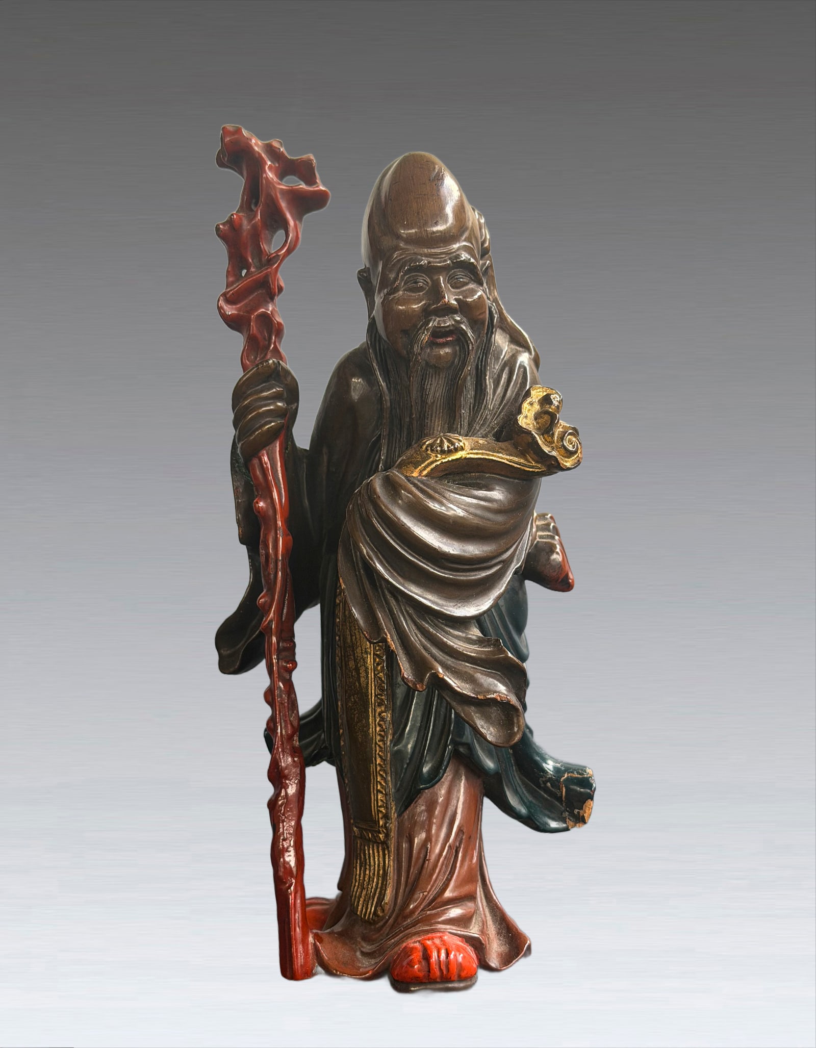 A Shouxingong Qing Dynasty: 261203 清木雕寿星公 A Shouxingong Qing Dynasty USD500-800 H21cm 整木精雕而成，木质坚实温
