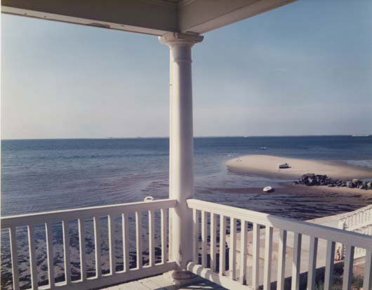 JOEL MEYEROWITZ, b. 1938: Porch, Provincetown, 1977 Color coupler print, printed 1988. Dimensions: 18 ½ x 23 ¼ in. (47 x 59.1 cm). Signed, titled and dated in ink on the verso.