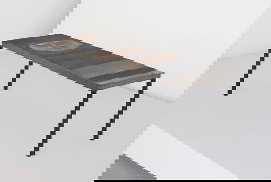 ROGER CAPRON, b. 1922: Coffee table, ca. 1960 Glazed ceramic tiles, metal, coated steel. Dimensions: 15 ⅜ x 47 ½ x 16 ⅛ in. (39.1 x 120.7 x 41 cm) Signed in the glaze "R. CAPRON."