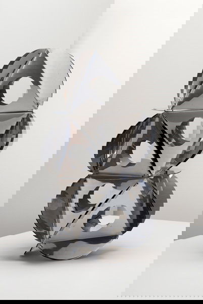 BRUNO MUNARI, 1907-1998: Sculpture, 1965 Chrome-plated metal. Dimensions: 29 ⅛ in. (74 cm) high, 16 ½ in. (41.9 cm) diameter For Danese, Italy, from an edition of 50. With the manufacturer's label, hand-written