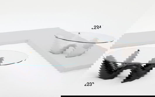 PHILIPPE JEAN: "Leda" coffee table, ca. 1975 Black lacquered resin, glass, brass. Dimensions: 13 ½ x 52 ⅞ x 28 ¾ in. (34 x 133.8 x 83 cm) Made for Maison Jansen, France. From an edition of appro