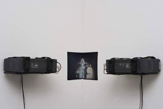 PAUL PFEIFFER, b. 1966: Live Evil (Bucharest), 2004 Two digital video loops (50 second loop), two metal armatures, two projectors, two DVD players, one frame synchronizer. Installation dimensions variable, projected image si