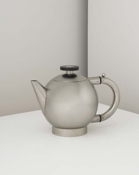 NAUM SLUTZKY, 1894-1965: Rare and important teapot, 1928 New silver, ebony. 7 in. (17.8 cm) high, 9 ⅛ in. (24 cm) diameter Impressed with Fritz Schleifer's cipher. Literature: Klaus Weber, Die Metallwerstatt Am Bauhaus