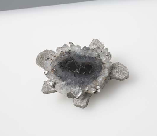 ANDREW GRIMA, B. 1921: Rare brooch, 1960s 18K white gold, Quartz crystal, diamond. 2 ¾ x 1 ⅞ in. (7 x 4.8 cm) Impressed "GRIMA," "0.750" and other hallmarks. Italian-born British designer Andrew Grima's distin
