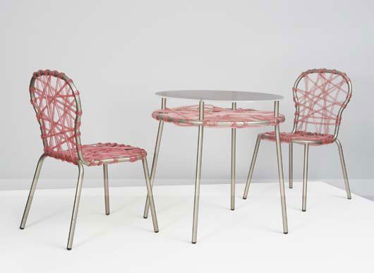 FERNANDO AND HUMBERTO CAMPANA, B. 1961, B. 1953: Pair of "Zig Zag" chairs and a "Zig Zag" table, 2001 Electrostatically-painted iron, PVC tubing, Perspex. Table: 29 ¾ in. (75.6 cm) high, 29 ½ in. (74.9 cm) diameter; each chair: 35 &fra