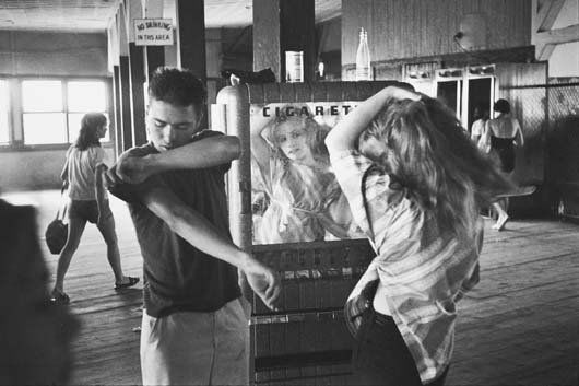 BRUCE DAVIDSON, b. 1933: Brooklyn Gang (girl combing hair), 1959. Gelatin silver print, printed later. 8 ⅝ x 13 in. (21.9 x 33 cm). Signed in ink on the verso. PROPERTY FROM A PRIVATE EUROPEAN COLLECTION Provenance: How