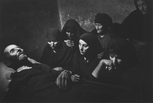 W. EUGENE SMITH, 1918-1978: Spanish Wake, 1951. Gelatin silver print from W. Eugene Smith: A Portfolio of Ten Photographs, printed 1977. 8 ¾ x 13 in. (22.2 x 33 cm). Signed in ink on the mount; numbered 8/25 in ink in an