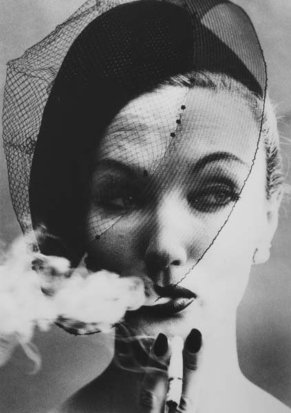 WILLIAM KLEIN, b. 1928: Smoke and Veil, Paris (Vogue), 1958. Gelatin silver print, printed later. 14 ⅛ x 9 ⅞ in. (35.9 x 25.1 cm). Signed, titled and dated in pencil on the verso.