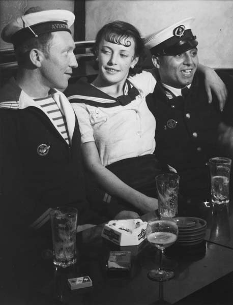 BRASSAI, 1899-1984 Conchita with sailors in a cafe