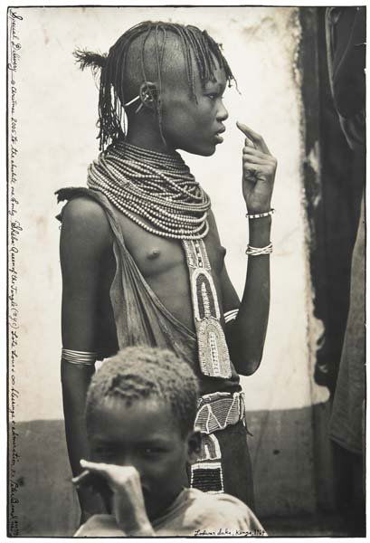 PETER BEARD, b. 1938 Lodwar Duka, Kenya, 1964 Tone: PETER BEARD, b. 1938 Lodwar Duka, Kenya, 1964 Toned gelatin silver print with ink, printed 2002. 22 5/8 x 15 1/8 in. (57.5 x 38.4 cm). Signed, titled, dated and