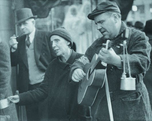 WALKER EVANS, 1903-1975 Street musician, Chicago,: WALKER EVANS, 1903-1975 Street musician, Chicago, November 2, 1942 Gelatin silver print. 7 ¾ x 9 5/8 in. (19.7 x 24.4 cm). Credit stamp on the verso. LITERATURE Corbeau & Renard, La tr