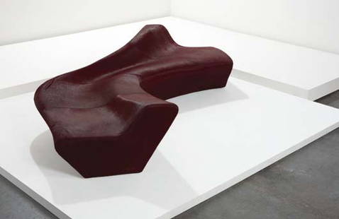 ZAHA HADID, b. 1950 "Moraine" sofa, designed 2000: ZAHA HADID, b. 1950 "Moraine" sofa, designed 2000 Foam, metal, hide. Manufactured by Sawaya & Moroni, Italy, from the Z-Scape Furniture series. Edge of base with leather label "SAWAYA&MORONI/MILAN