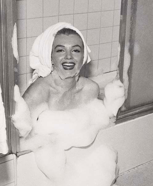 ANDRE DE DIENES, 1913-1985: Marilyn Monroe, 1953 Gelatin silver print. 7 1/2 x 6 1/4 in. (19.1 x 15.9 cm). Titled, dated and stamped on verso. This work is accompanied by a certificate of authenticity.